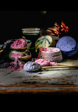Load image into Gallery viewer, Superfood powders spilling over next to cheese wheels on table
