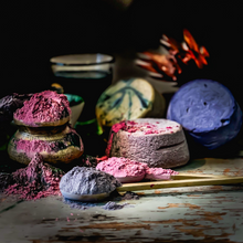 Load image into Gallery viewer, Superfood powders spilling over next to cheese wheels on table
