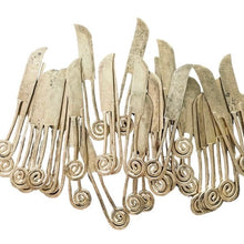Load image into Gallery viewer, An assortment of tarnished golden knives with spiral handles.
