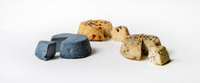Load image into Gallery viewer, three cheese wheels, one blue, one orange, one gray
